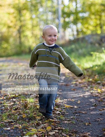 Boy on forest path