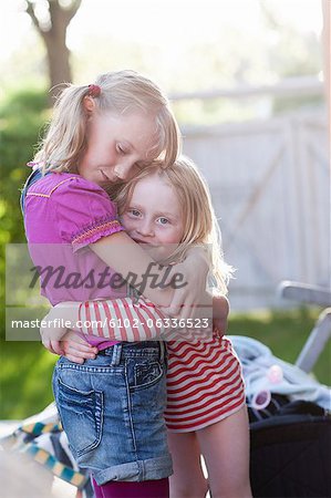 Two sisters embracing