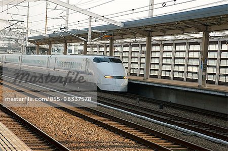 A bullet train passes Hemeji Station, Hyogo Prefecture, Japan