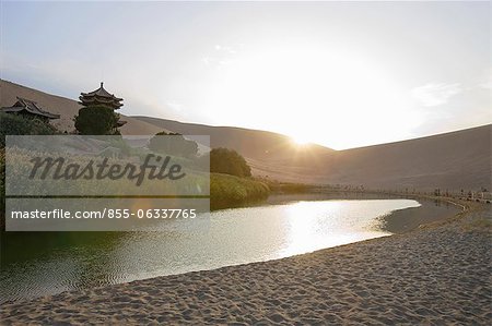 Sunset over Yueyaquan (Crescent moon lake), Mingsha Shan, Dunhuang, Silkroad, Gansu Province, China