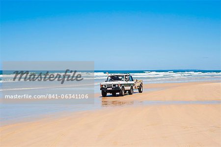 Tourists driving on Seventy Five Mile Beach on a self drive 4x4 tour of Fraser Island, UNESCO World Heritage Site, Queensland, Australia, Pacific