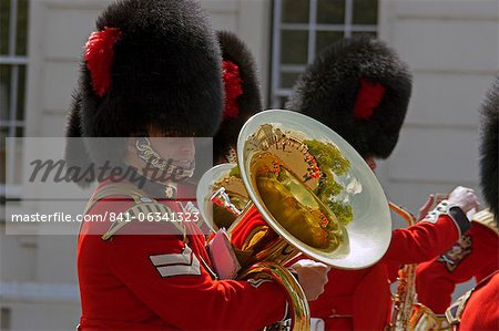 Coldstream Guards band practise at Wellington Barracks, reflected in the brass tuba, London, England, United Kingdom, Europe