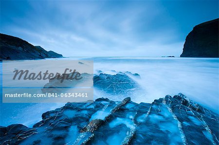 Long exposure at twilight on Crackington Haven beach on North Cornwall, England, United Kingdom, Europe