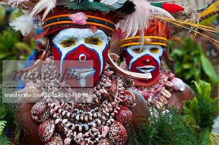 Colourfully dressed and face painted local tribes celebrating the traditional Sing Sing, Enga, Highlands of Papua New Guinea, Pacific