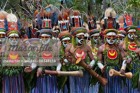 Colourful dressed and face painted local tribes celebrating the traditional Sing Sing in Paya, Papua New Guinea, Melanesia, Pacific