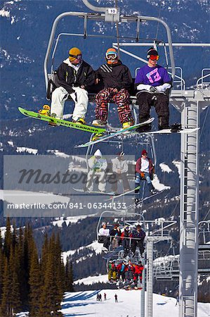 Chairlift carrying skiers and snowboarders, Whistler Mountain, Whistler Blackcomb Ski Resort, Whistler, British Columbia, Canada, North America