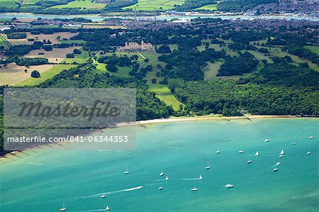 Aerial view of yachts racing in Cowes Week on the Solent, with Osborne House in background, Isle of Wight, England, United Kingdom, Europe