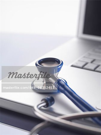 Close up of stethoscope on laptop