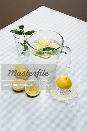 Lemons, herbs and pitcher of water