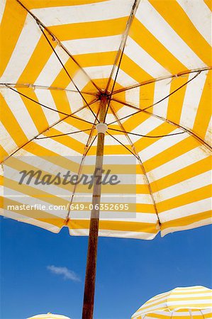 Striped umbrella under blue sky