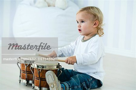 Baby boy playing drums