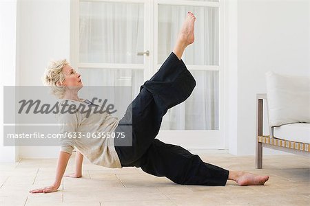 Mature woman practicing pilates