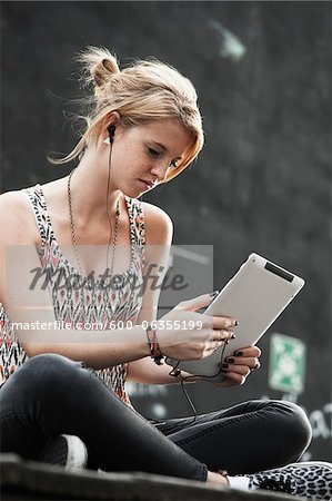 Teenage Girl Listening to iPad, Mannheim, Baden-Wurttemberg, Germany