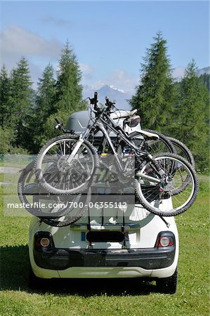 Bicycles Loaded onto Back of Car