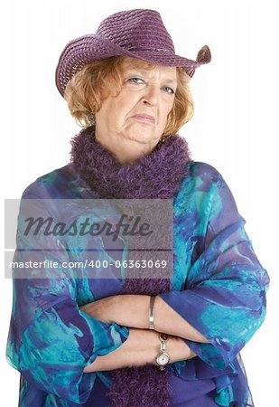 Frowning old lady with folded arms over white