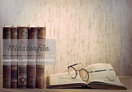 Vintage books and glasses on desk