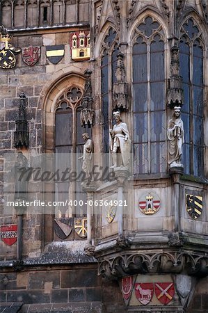 Closeup of Prague Town Hall window with sculptures and arms, Czech Republic