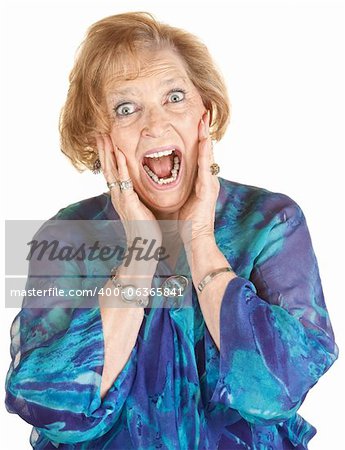 Lady in blue and hands on face screaming