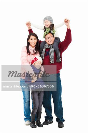 full length of happy asian family in winter clothes standing together and isolated on white