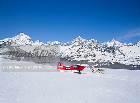Red sky plane above a glacier