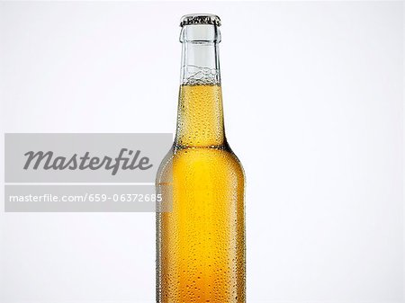 A bottle of beer with a bottle cap