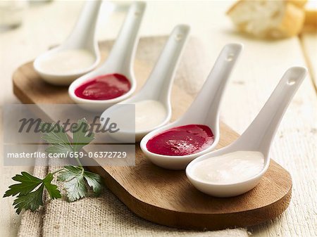 Kohlrabi and beetroot sauce on porcelain spoons