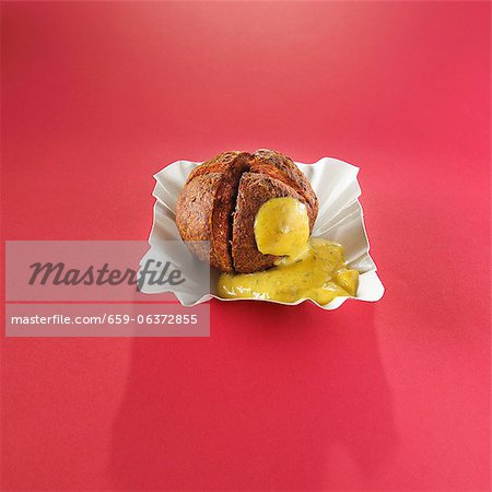 A meat ball with sweet mustard