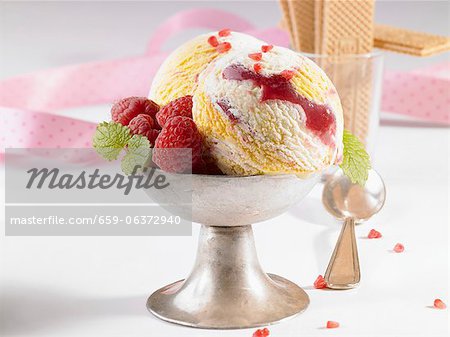 Marbled ice cream with fresh raspberries in an ice cream cup