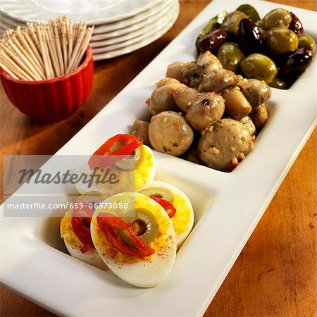 Three Part Serving Dish with Deviled eggs, Marinated Mushrooms and Olives; Bowl of Toothpicks Three Part Serving Dish with Deviled eggs, Marinated Mushrooms and Olives; Bowl of Toothpicks