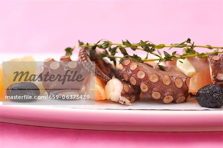 Warm octopus with olives and pink grapefruit