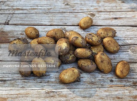 Potatoes on wooden background