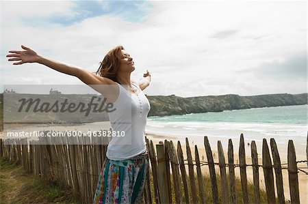 Woman with Open Arms at the Beach, Camaret-sur-Mer, Crozon Peninsula, Finistere, Brittany, France