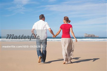 Couple Holding Hands and Walking on the Beach, Camaret-sur-Mer, Crozon Peninsula, Finistere, Brittany, France