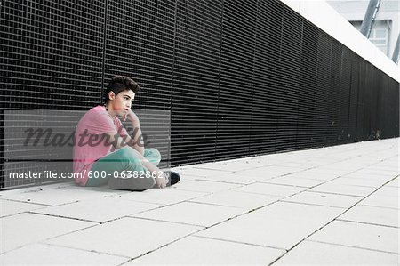 Boy Sitting on the Ground, Mannheim, Baden-Wurttemberg, Germany