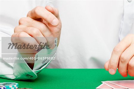 male player at the card table in the casino