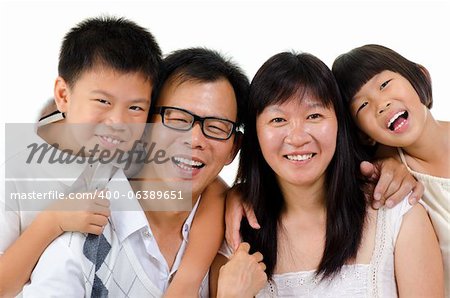 Portrait of happy Asian family isolated on white background