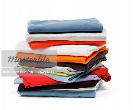 Stack of Color T-Shirts and Clothes isolated on white background