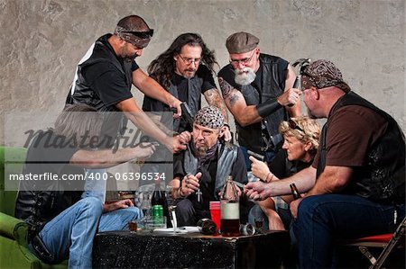 Biker gang members threatening man in bandana