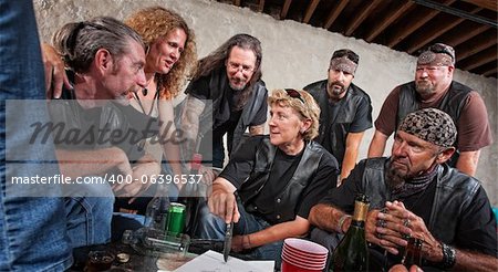 Female biker gang leader discusses plans with members