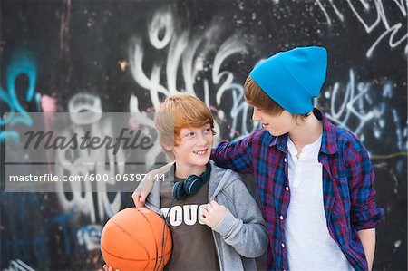 Boys with Basketball by Graffiti Covered Wall, Mannheim, Baden-Wurttemberg, Germany