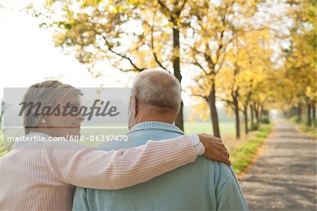 Mature Woman with Arm around Shoulder of Senior Father in Autumn, Lampertheim, Hesse, Germany