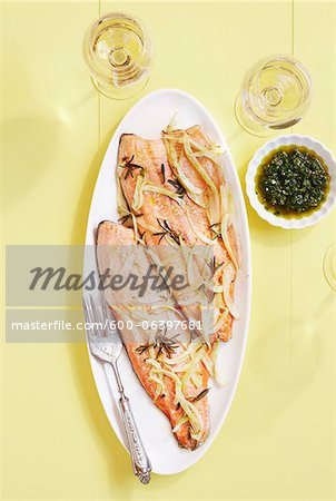 Overhead View of Trout Cooked with Fennel and Two Glasses of White Wine