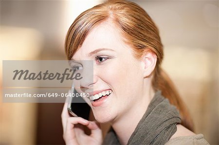 Smiling woman talking on cell phone