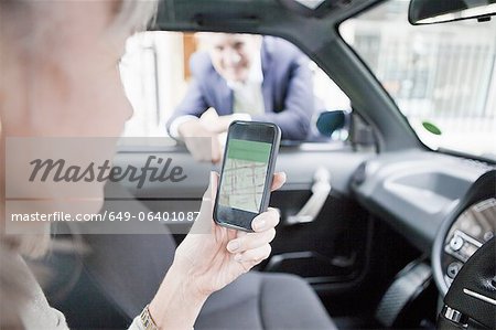 Woman getting directions on cell phone