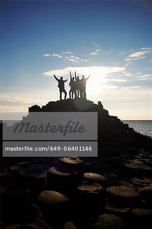 Silhouette of people on Giant's Causeway