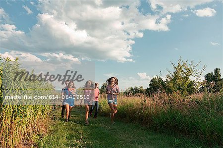 Five friends running through field