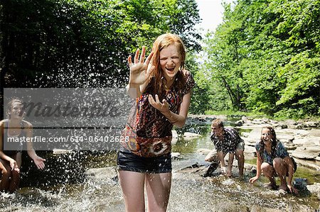 Friends playing in river