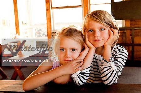 Girl close to boy at picnic table