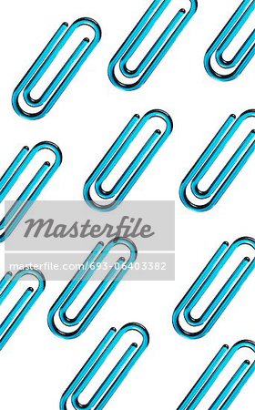 Blue paper clips against white background