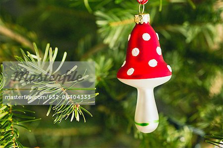 Mushroom shaped Christmas ornament on tree
